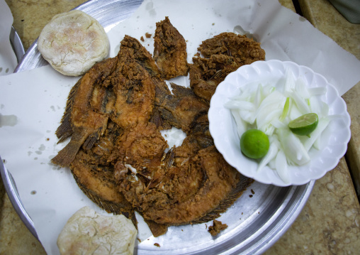 Traditional sudanese food with fried fishes and lemons, Khartoum State, Khartoum, Sudan