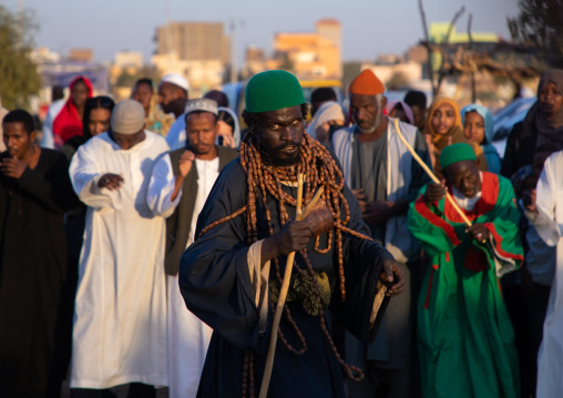 Sufi man with huge necklaces during the friday celebration at sheikh Hamad el Nil tomb, Khartoum State, Omdurman, Sudan