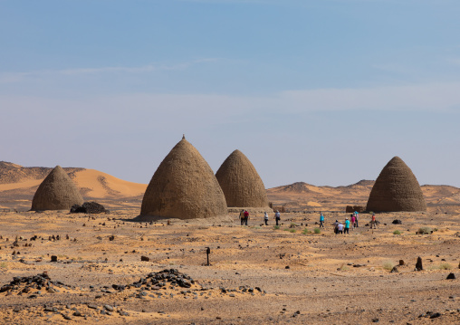 Tourists visiting the beehive tombs, Nubia, Old Dongola, Sudan
