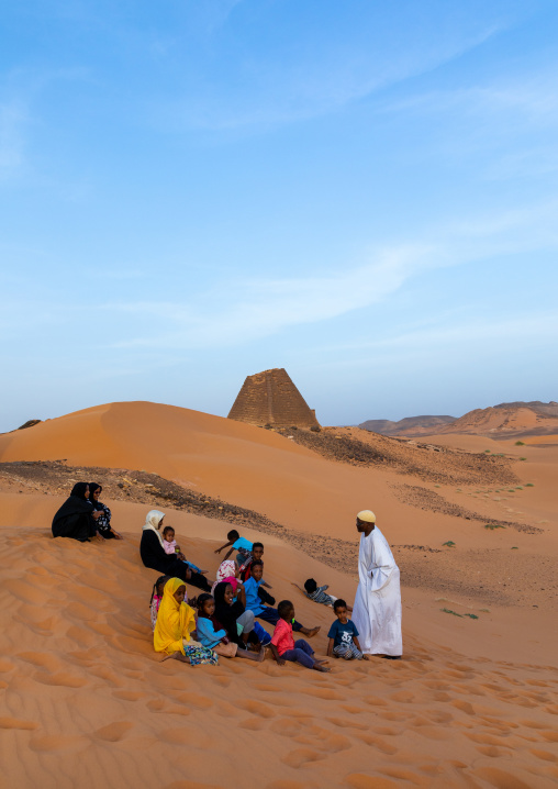 Sudanese tourists visiting the pyramids of the kushite rulers at Meroe, Northern State, Meroe, Sudan