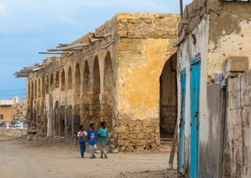 Sudanese children in front of an old building on mainland, Red Sea State, Suakin, Sudan