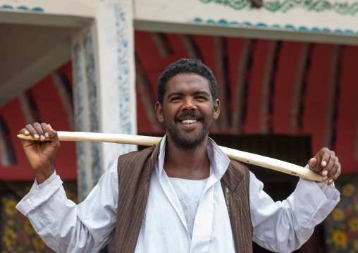 Portrait of a Beja tribe man with a wooden stick, Red Sea State, Port Sudan, Sudan