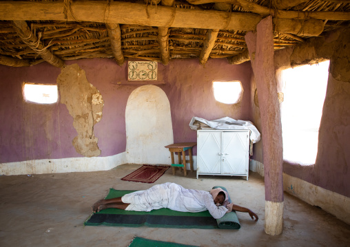 Sudanese man sleeping inside a small mosque, Kassala State, Kassala, Sudan