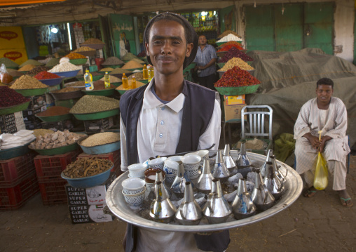 Sudan, Khartoum State, Omdurman, man seeling coffe in the bazaar