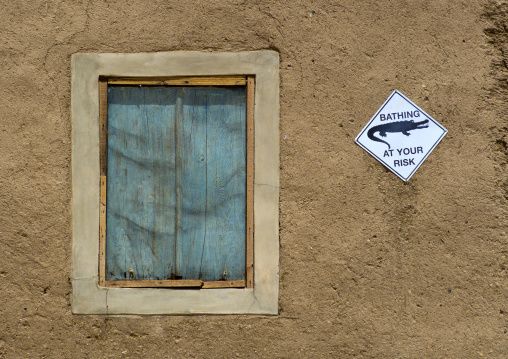 Sudan, Nubia, Sai island, crocodile warning sign on a house