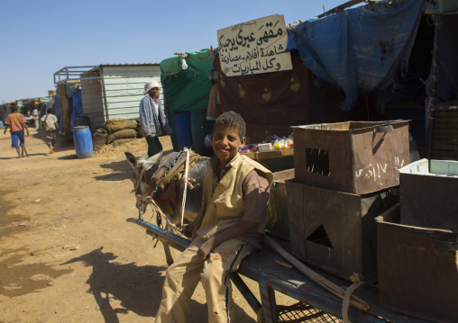 Sudan, Khartoum State, Alkhanag, boy with his cart