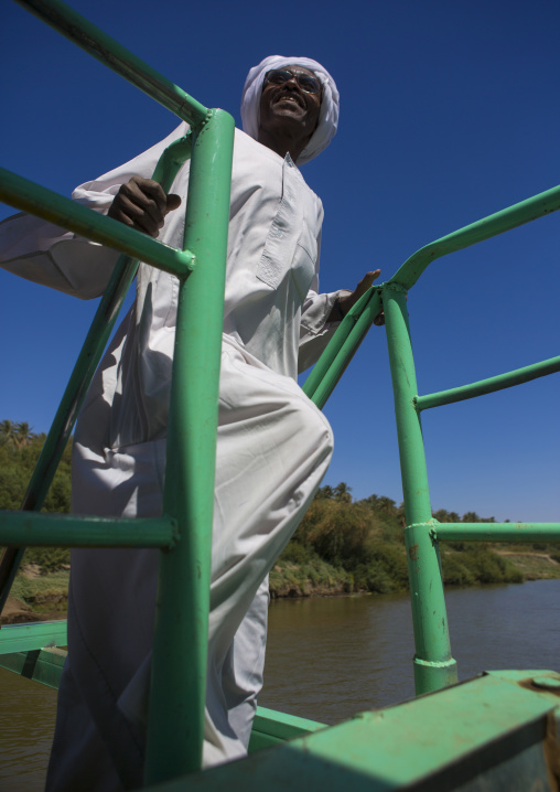 Sudan, Northern Province, Delgo, sudanese man on a ferry on river nile
