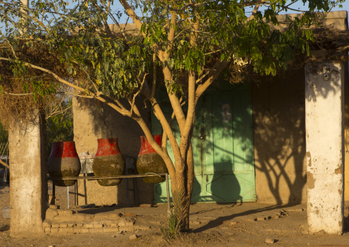 Sudan, Nubia, Tumbus, wjars for drinking water in front of a house