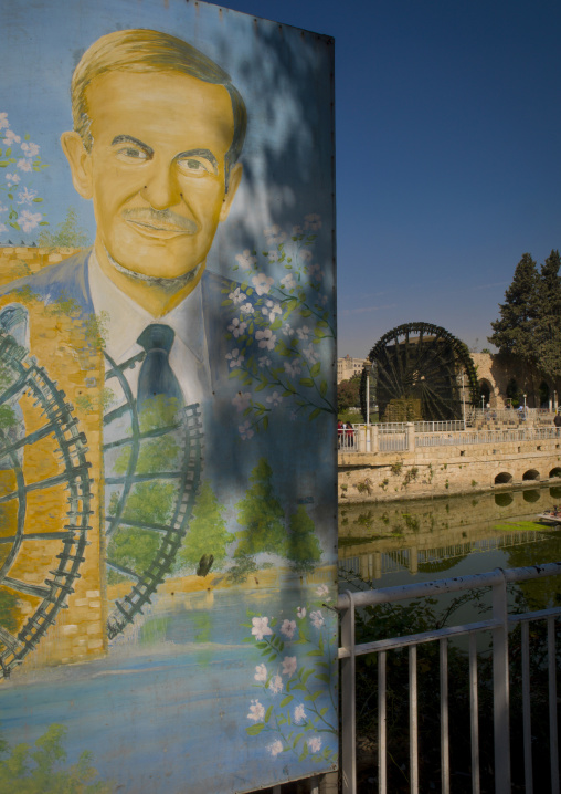 Hafez Al Assad Poster In Front Of The Norias Of Bechriyyat, Hama, Hama Governorate, Syria