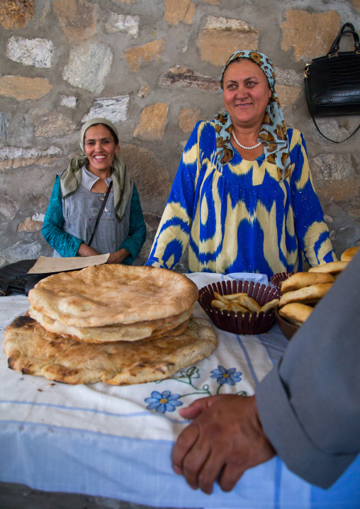 Tajik women selling bread in the market border with Afghanistan, Central Asia, Ishkashim, Tajikistan