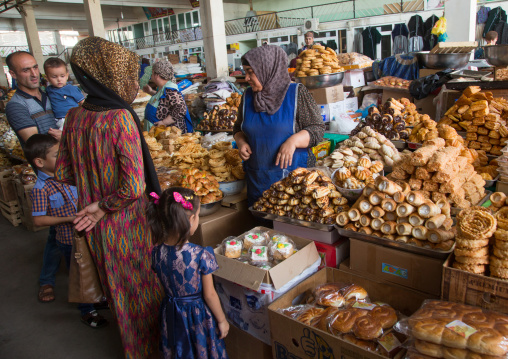 Tajik women selling cakes in a local market, Gorno-Badakhshan autonomous region, Khorog, Tajikistan