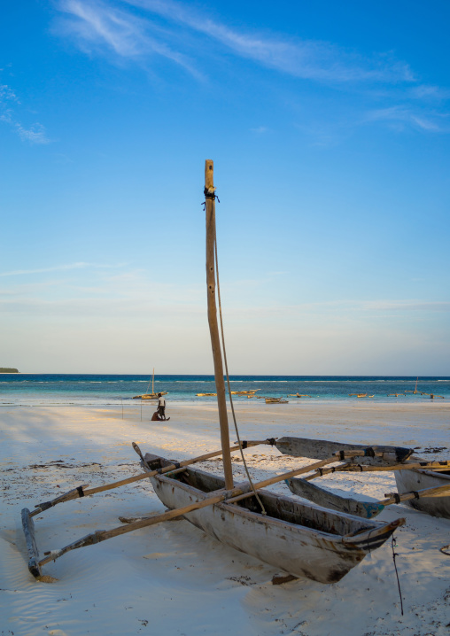 Tanzania, Zanzibar, Matemwe, a wooden fishing dhow resting on a sandy beach