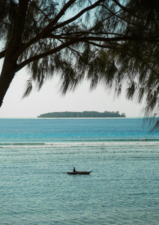 Tanzania, Zanzibar, Matemwe, canoe passing in front of mnemba island