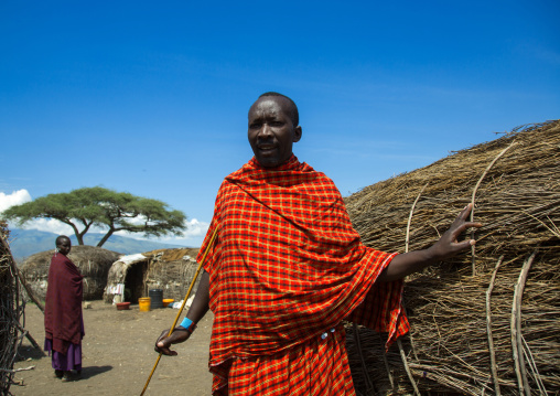 Tanzania, Ashura region, Ngorongoro Conservation Area, maasai man outside his home