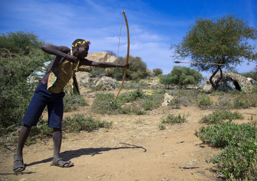 Tanzania, Serengeti Plateau, Lake Eyasi, hadzabe man with bow and arrow