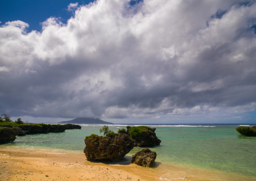 Big rocks on Eton beach with a cloudy sky, Shefa Province, Efate island, Vanuatu