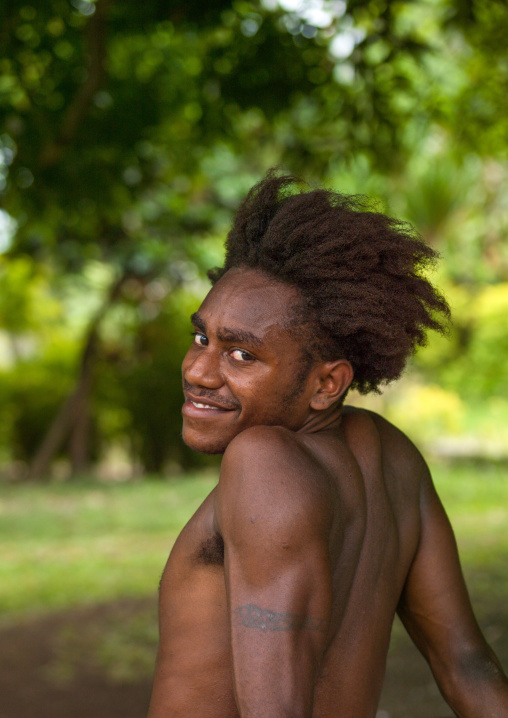 Portrait of a Ni-Vanuatu young man with tattoos on the arms, Malampa Province, Malekula Island, Vanuatu