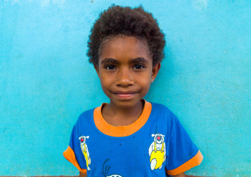 Portrait of a Ni-Vanuatu girl in front of a blue wall, Malampa Province, Malekula Island, Vanuatu