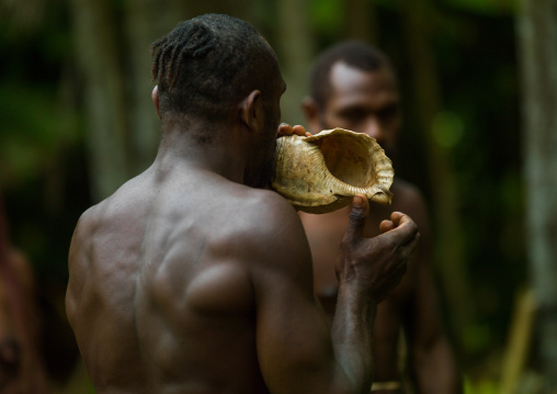 Big Nambas tribesman blowing in a shell, Malampa Province, Malekula Island, Vanuatu