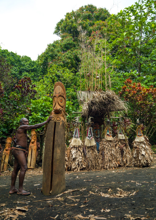 Rom dance masks and giant slit drum during a ceremony, Ambrym island, Fanla, Vanuatu