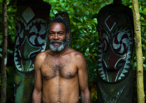 Portrait of a leader in front of slit drums, Ambrym island, Olal, Vanuatu