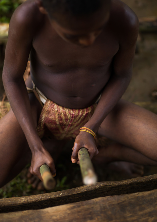 Ni-Vanuatu beating on a slit drum, Sanma Province, Espiritu Santo, Vanuatu