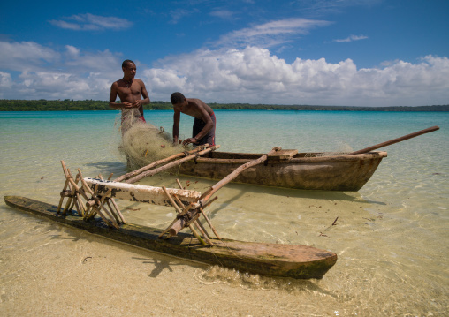 Young boys of the Ni-Vanuatu people with their dugout, Sanma Province, Espiritu Santo, Vanuatu