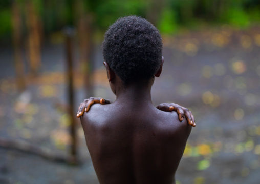 Rear view of a boy feeling cold, Tanna island, Yakel, Vanuatu