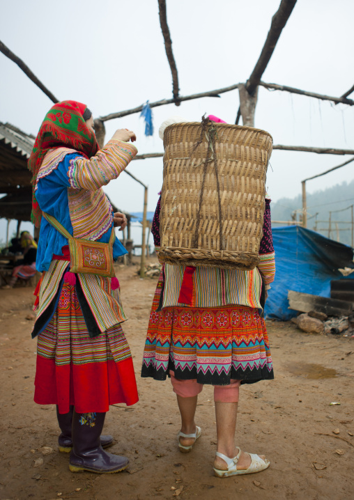 Flower hmong women with a basket at sapa market, Vietnam