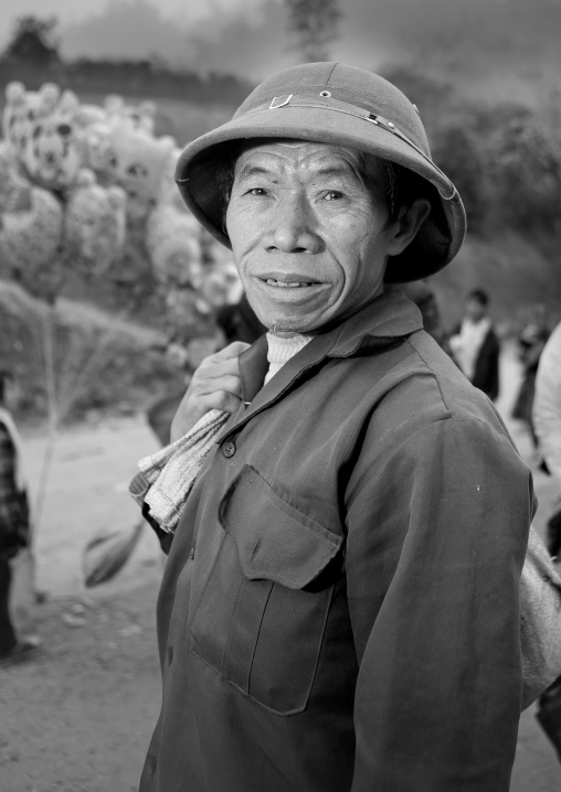 Man with a colonial hat on a market place, Sapa, Vietnam