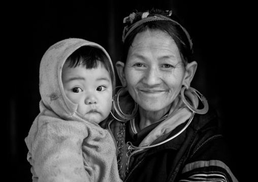 Black hmong grandmother with her grandson in the arms, Sapa, Vietnam