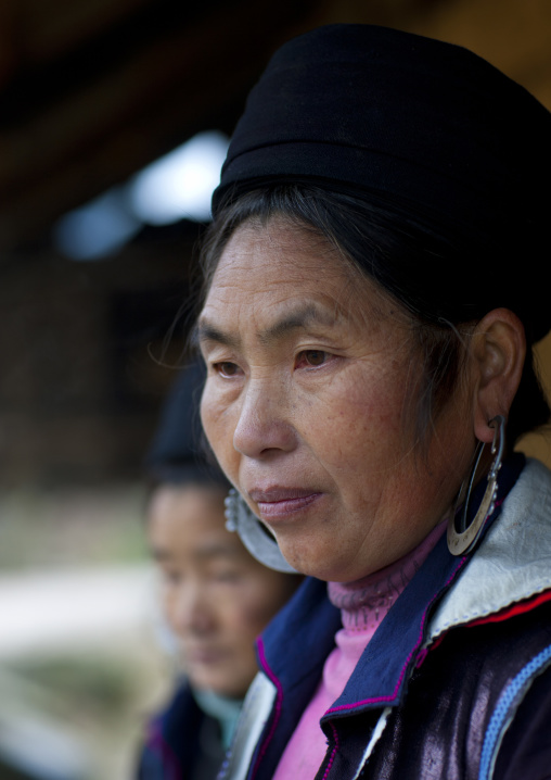 Black hmong woman with traditional hat and earrings, Sapa, Vietnam