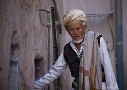 Old Yemeni Man Wearing Traditional Clothes And A Jambiya In A Street Of Sanaa, Yemen