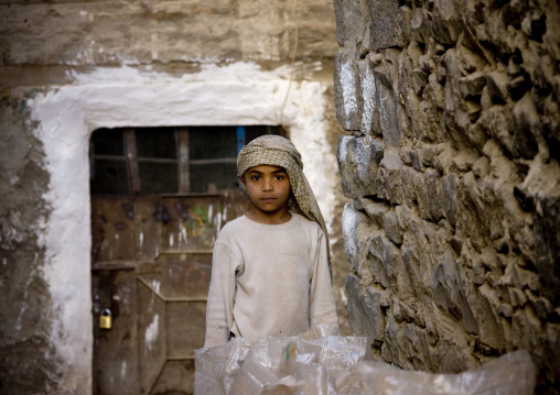 Young Boy With Traditional Turban Pushing A Cart, Sanaa, Yemen