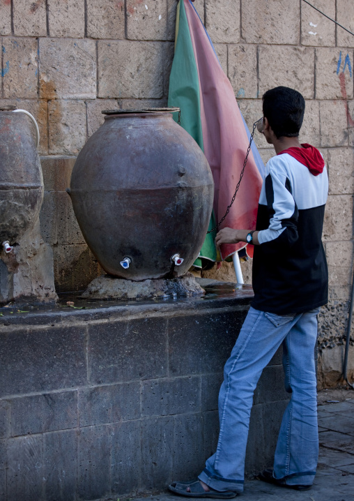 Man Drinking At A Public Fountain In Sanaa, Yemen