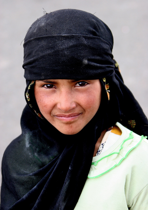 Portrait Of A Smiling Girl Wearing A Black Niqab, Al Hajjara, Yemen