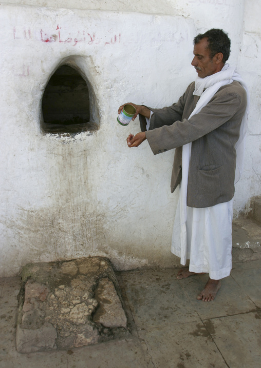 Man Doing Ritual Ablutions Before Prayer At The Mosque, Yemen