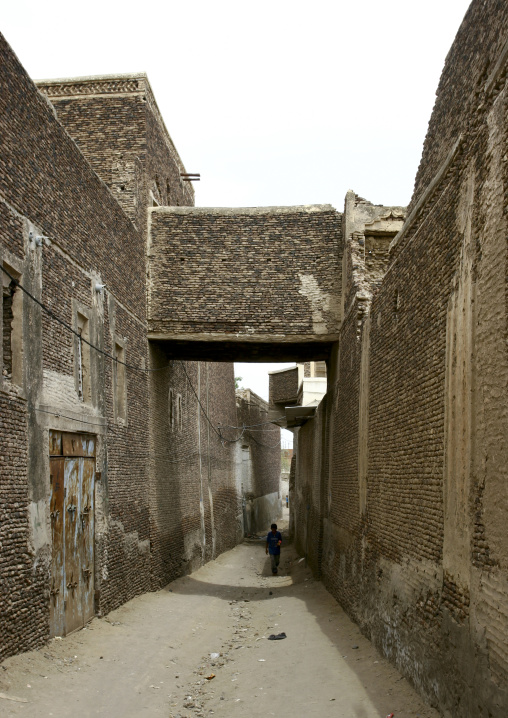 Boy Walking In An Old And Narrow Street, Zabid, Yemen