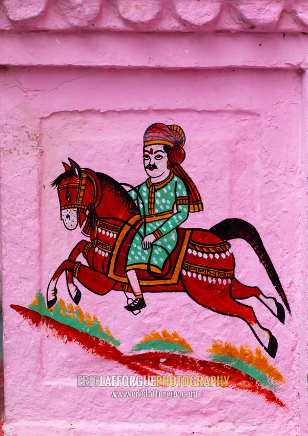 ERIC LAFFORGUE PHOTOGRAPHY - Murals depicting a horseman on a pink ...