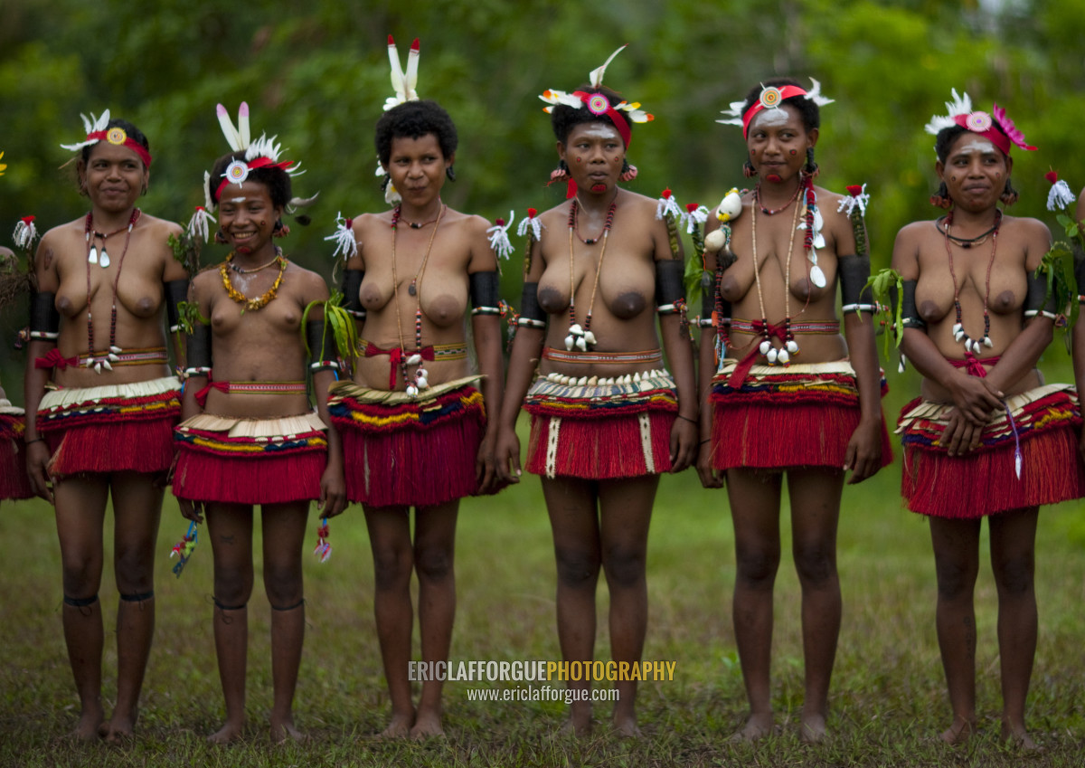 Portrait of topless tribal women in traditional clothing, Milne Bay Provinc...