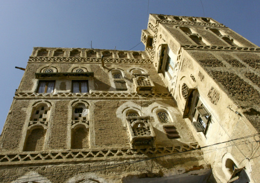 Traditional house in the old city featuring stained-glass windows, Amanat Al-Asemah, Sanaa, Yemen