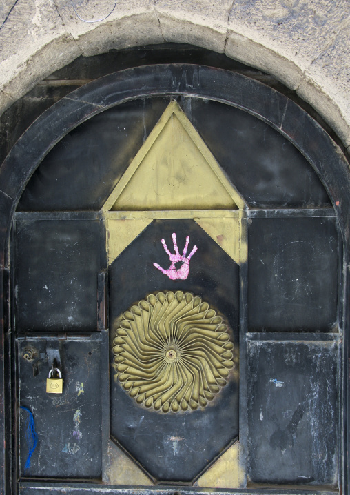 Handprint to protect from the evil eye on a door, Amanat Al-Asemah, Sanaa, Yemen
