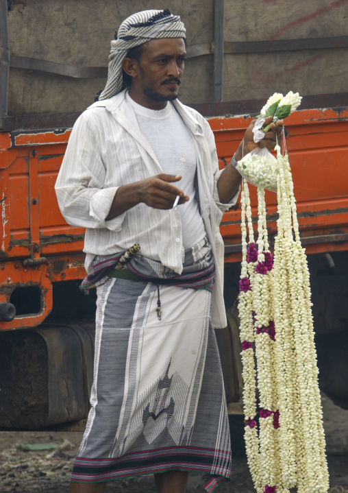 Yemeni man selling jasmin garlands, Al Hudaydah Governorate, Hodeidah, Yemen