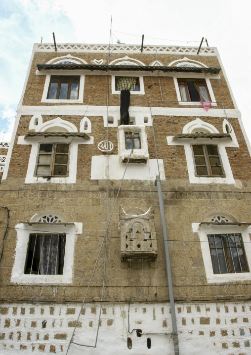 Traditional house in the old city featuring stained-glass windows, Amanat Al-Asemah, Sanaa, Yemen