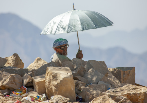 Portrait of a senior man with an umbrella, Amran Governorate, Hababah, Yemen