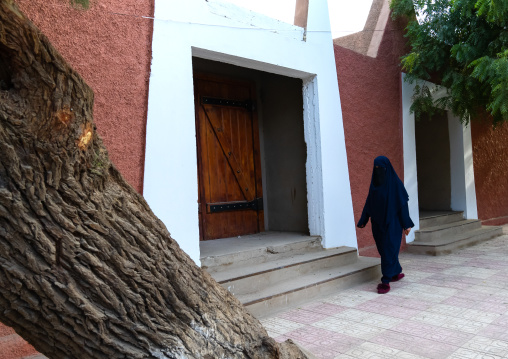 veiled woman walking in the street, North Africa, Tamanrasset, Algeria