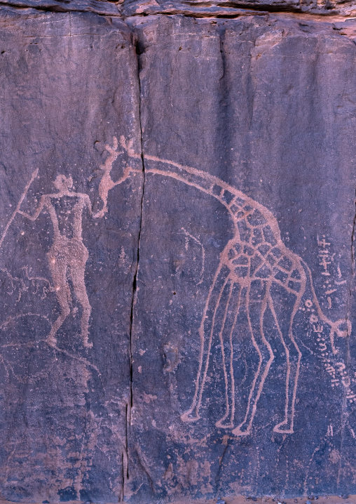 Rock carvings depicting a warrior with giraffes, Tassili N'Ajjer National Park, Tadrart Rouge, Algeria