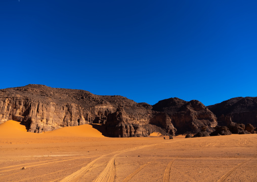 Rocks and sand dunes in Sahara desert, Tassili N'Ajjer National Park, Tadrart Rouge, Algeria