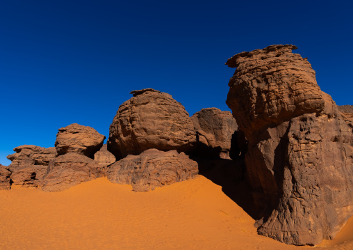 Rocks and sand dunes in Sahara desert, Tassili N'Ajjer National Park, Tadrart Rouge, Algeria