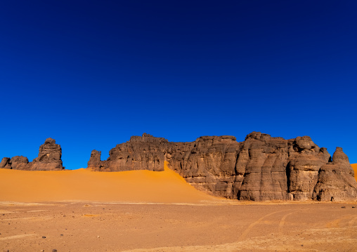 Rocks and sand dunes in Sahara desert, Tassili N'Ajjer National Park, Tadrart Rouge, Algeria